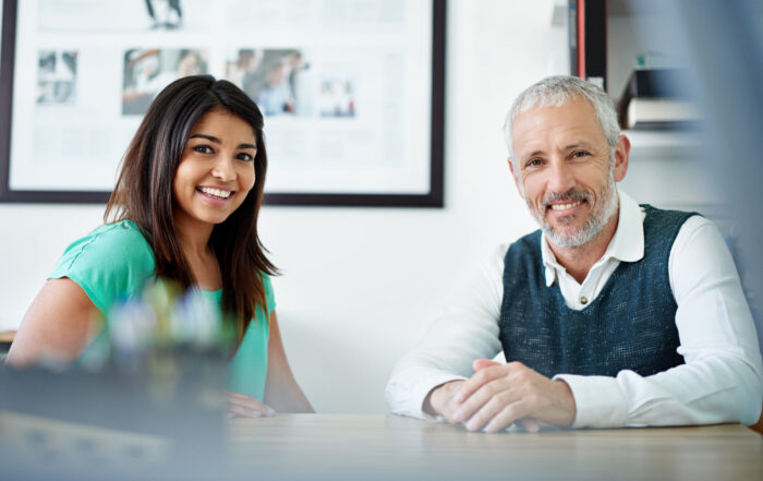 Local accountant for Hampshire businesses - two people looking happy at a desk